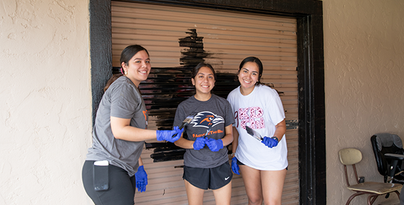 Students from the University of Texas at San Antonio (UTSA) painted buildings on the Boysville campus. 