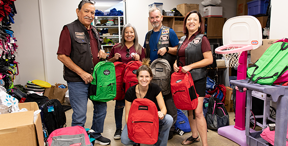 Guardians of the Children Von Ormy Chapter stuffed backpacks full of comfort activities like coloring books for the children that ChildSafe serves.